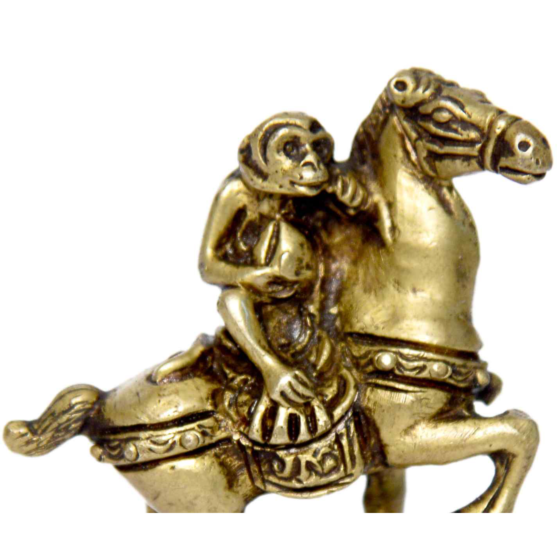 Brass monkey sitting on horse | KBH01042