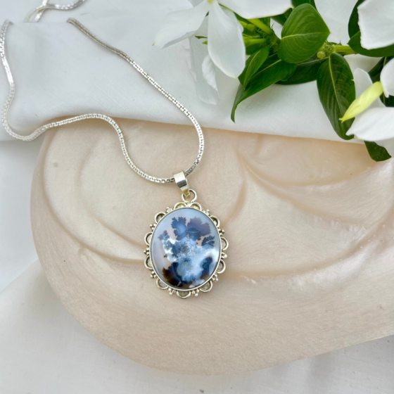 Inkblossom Sky pendant by Ochrello featuring deep indigo dendritic patterns within a polished Shazar stone, set in an ornate silver bezel.
