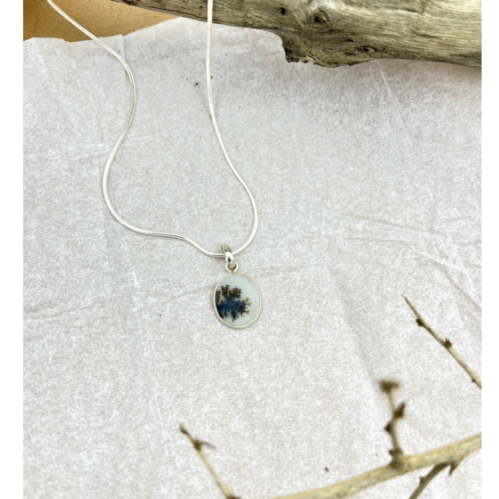 Serene River pendant by Ochrello showcasing an oval Shazar stone with blue and black dendritic inclusions set in elegant sterling silver.