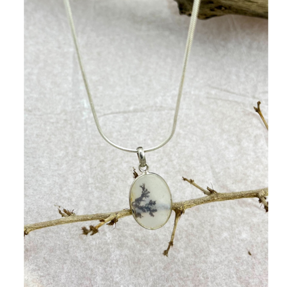 Close-up of oval Shazar stone in sterling silver bezel – showcasing intricate dendritic inclusions that resemble a quiet forest in fog.