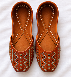 Handcrafted leather juttis with embroidery