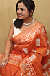 Semi Linen Batik Print Saree with Silver Zari Border & Running Blouse - Orange Premium Look