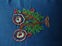 Thread embroidered cushion cover 
