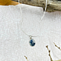 Midnight Grove pendant by Ochrello showcasing an oval Shazar (dendritic agate) stone with bold blue-black inclusions in a sterling silver frame.