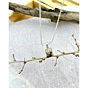 Styled presentation of Forest Dream pendant hanging gracefully from a branch, emphasizing its earthy and artisanal appeal.