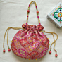 Handcrafted Peach Brocade Silk Potli Bag with Traditional Motifs
