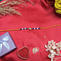 Elegant Blue & White Pearl Rakhi